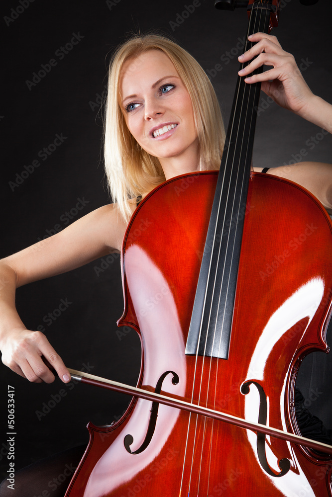 Beautiful young woman playing cello Beautiful young woman playing cello