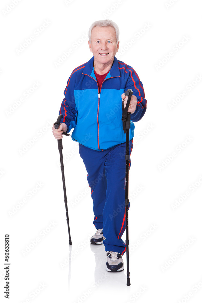Senior Man Walking With Hiking Poles Senior Man Walking With Hiking Poles