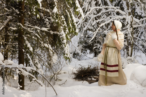 Russian girl in the winter woods