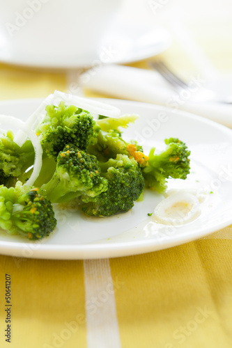 roasted broccoli on white plate
