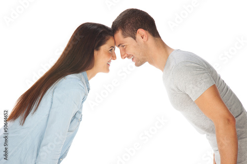Young couple staring at each other and smiling