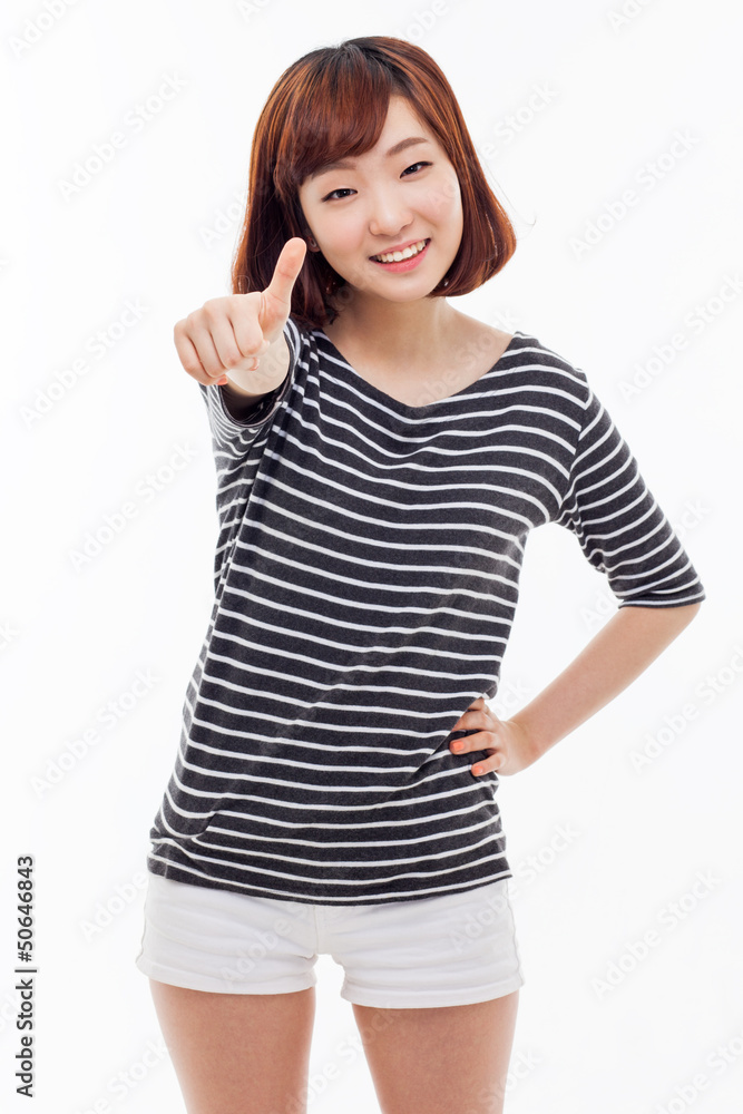 Young Asian woman showing thumb. Young Asian woman showing thumb.