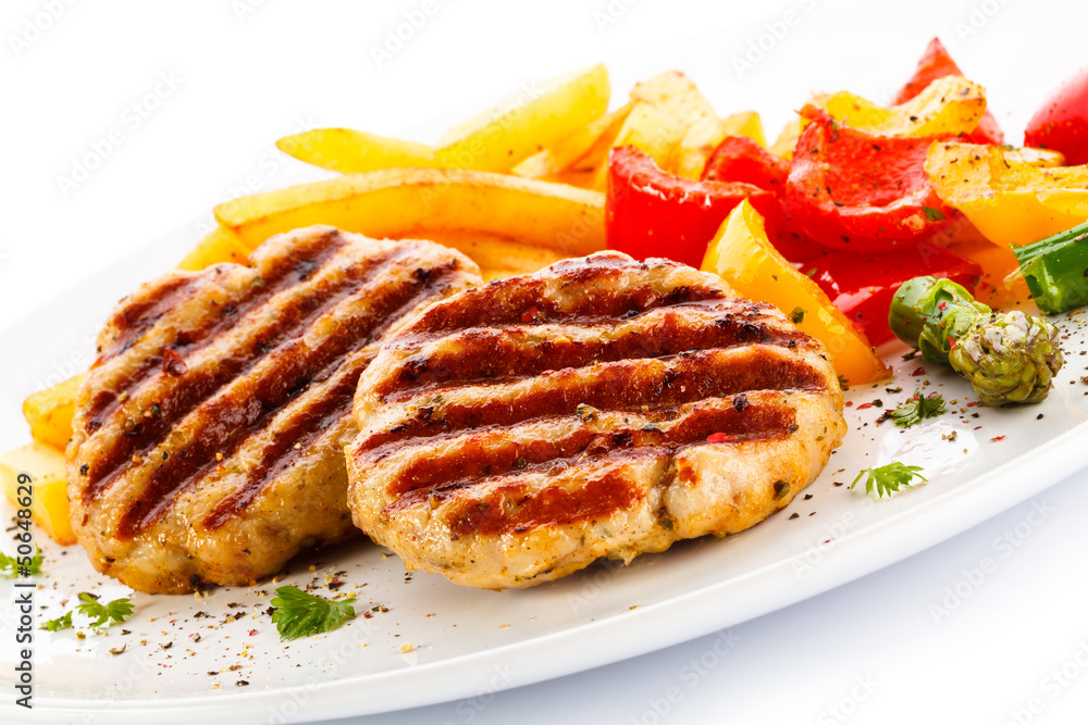 Grilled steak, French fries and vegetables Grilled steak, French fries and vegetables