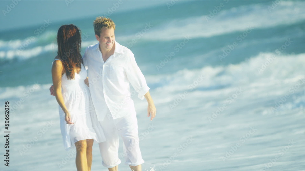 Married Couple Enjoying Time Together on Beach Married Couple Enjoying Time Together on Beach