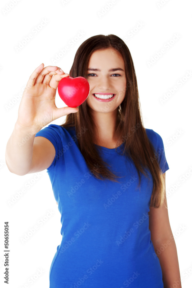 Pretty teen girl showing red heart. Pretty teen girl showing red heart.
