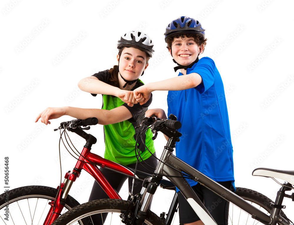 Naklejka premium Cyckists - boy and girl isolated on white background
