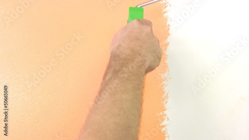 Paint rollers in hand