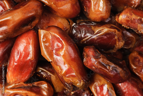Fine dried date fruits macro background
