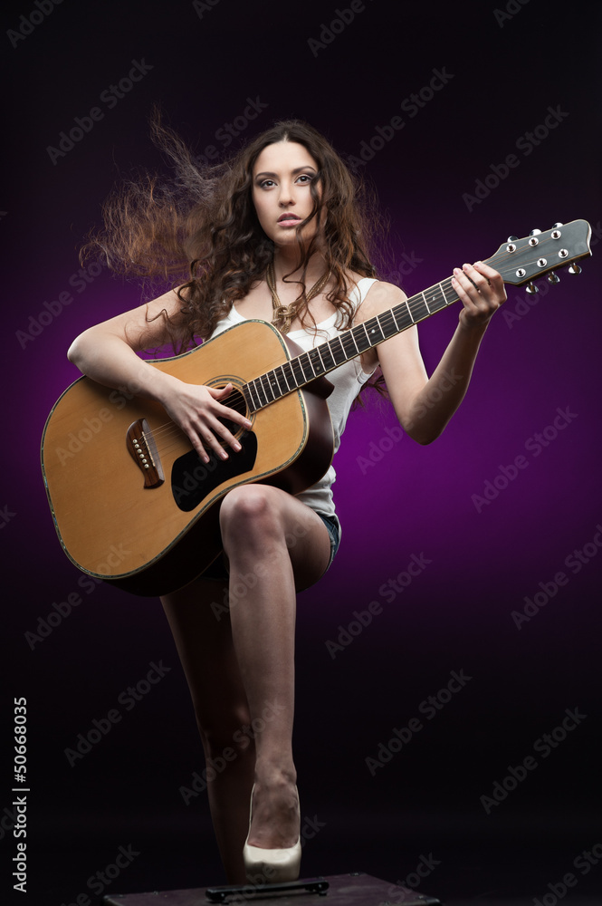sexy girl holding guitar
