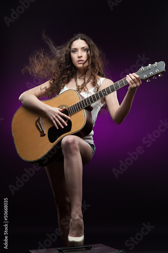 sexy girl holding guitar