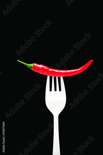 Red pepper isolated on the black background © Elnur