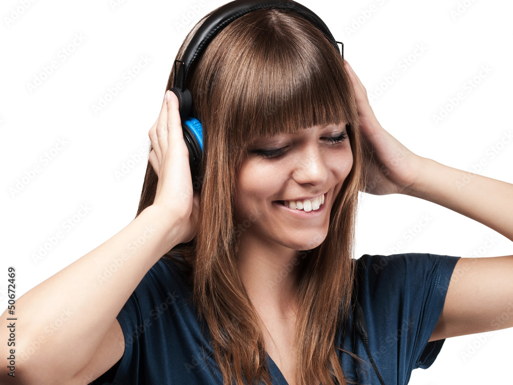 young woman smiling about her music - isolated young woman smiling about her music - isolated