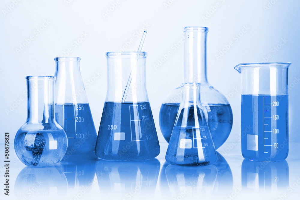 Test tubes with colorful liquids in blue light Test tubes with colorful liquids in blue light
