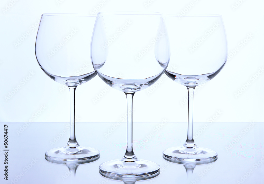 Empty wine glasses arranged and isolated on white Empty wine glasses arranged and isolated on white