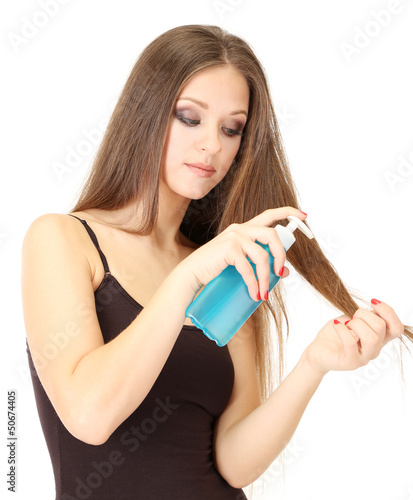 Woman with long hair holdin...