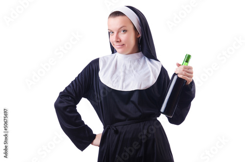 Nun with bottle of red wine