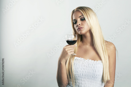 Beautiful blond woman with glass of wine
