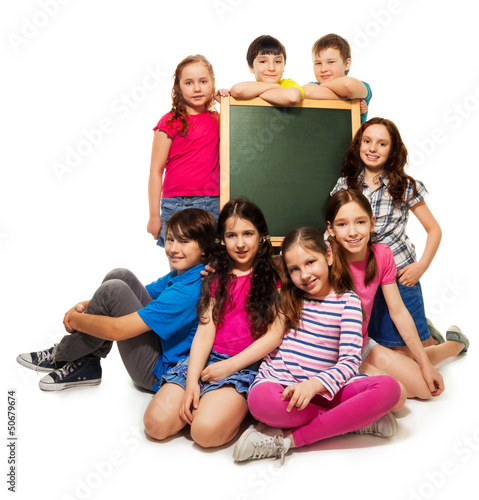 Large group of school kids and blackboard