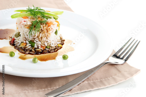 Delicious risotto with vegetables isolated on white