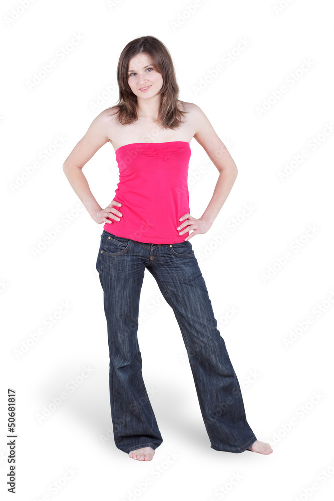 Young barefooted woman in blue jeans and in red blouse