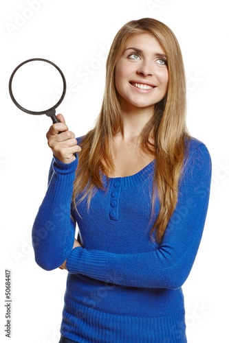 Smiling young female holding magnifying glass © paffy