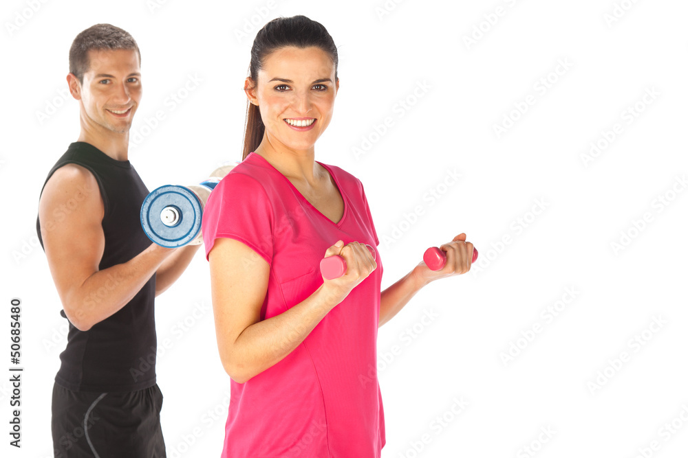 Young couple exercising with weights together Young couple exercising with weights together