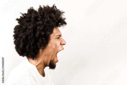 Emotional facial expression of man - scream photo