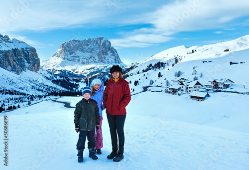 Morning winter Gardena Pass in Dolomites and family.