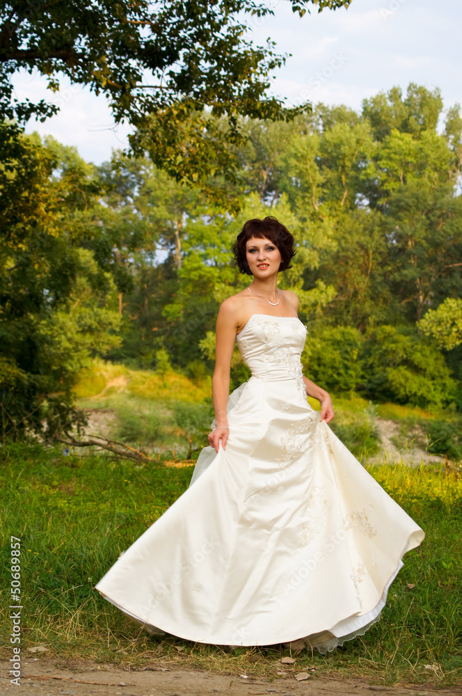 Cute little girl in a wedding dress