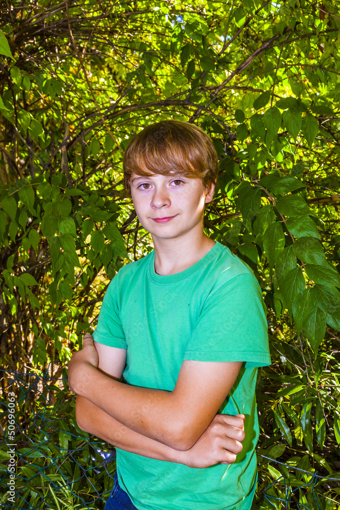 cute smart boy in the garden under the tree cute smart boy in the garden under the tree