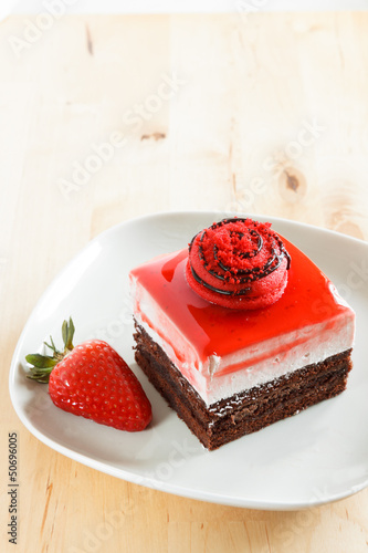 Strawberry bavaroise with chocolate cake photo