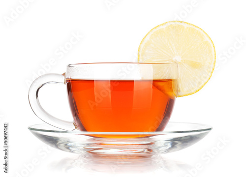 Glass cup of black tea with lemon slice