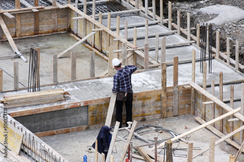 Carpenter at work on site photo