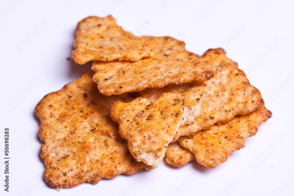 Spiced cracker isolated on white. crispy snack Spiced cracker isolated on white. crispy snack