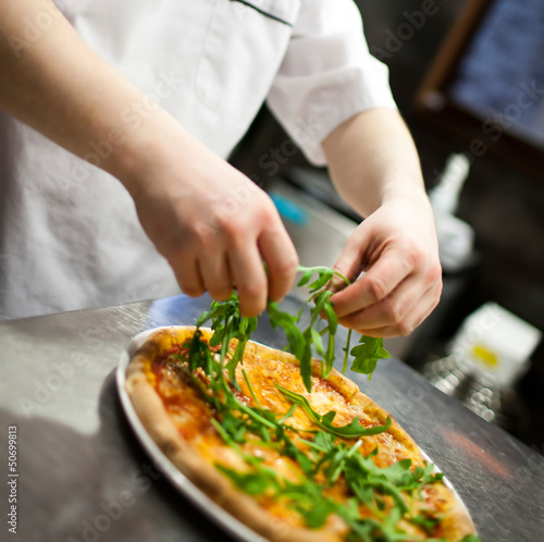 Fototapeta Naklejka Na Ścianę i Meble -  baker chef making Pizza