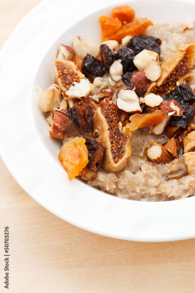oatmeal with raisins, nuts and maple syrup oatmeal with raisins, nuts and maple syrup