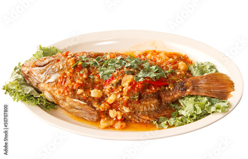 Canvas Print fried fish with fresh herbs and  sweet spicy sauce  on plate