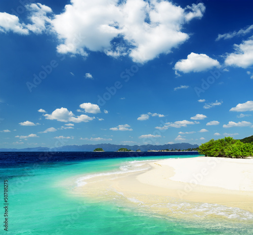 White sand beach and blue sky © efired