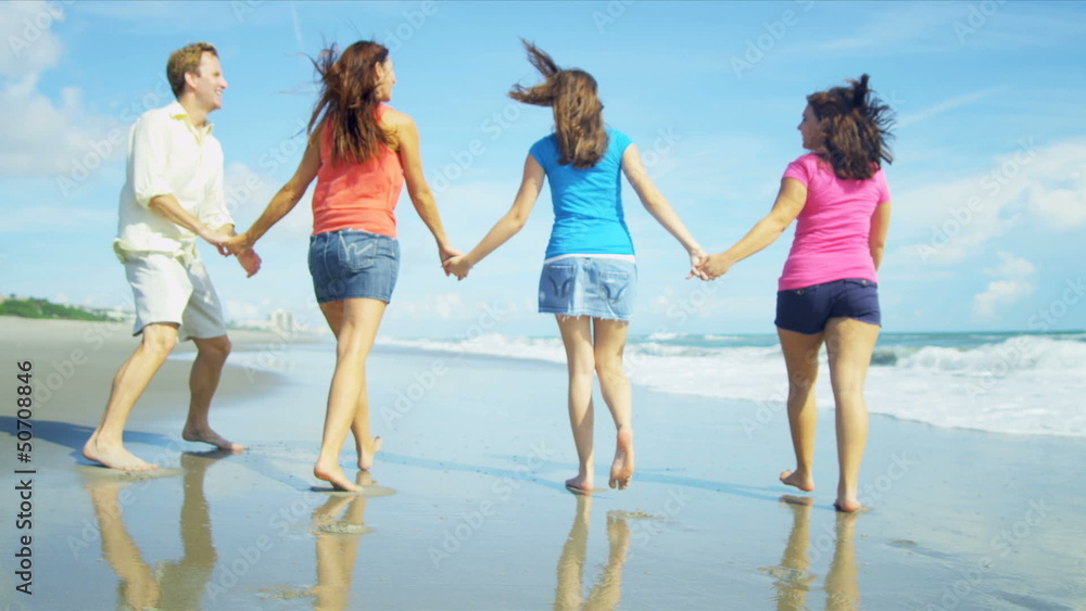 Happy Caucasian Family Walking Outdoors Wet Sand on Beach Happy Caucasian Family Walking Outdoors Wet Sand on Beach