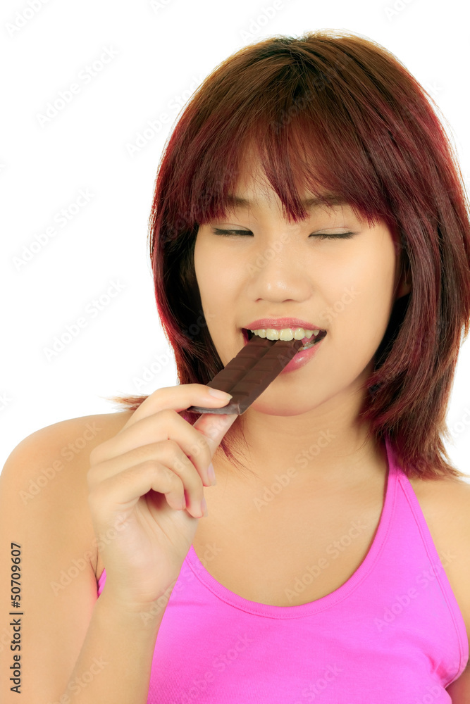 Young asian woman with chocolate bar Young asian woman with chocolate bar