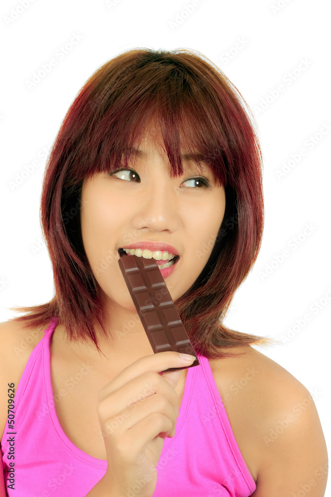 Young asian woman with chocolate bar Young asian woman with chocolate bar