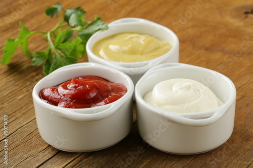 Fotografie mustard, ketchup and mayonnaise - three kinds of sauces