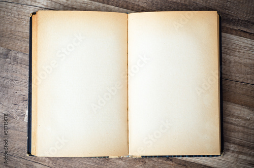 open old book on a wooden surface