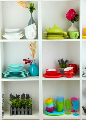Beautiful white shelves with tableware and decor.