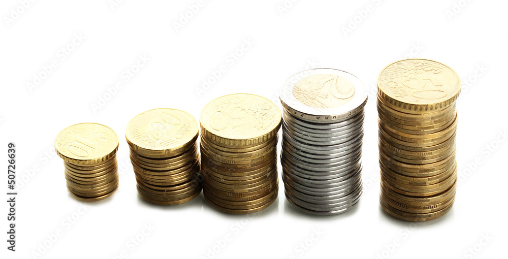 Many coins in columns isolated on white Many coins in columns isolated on white