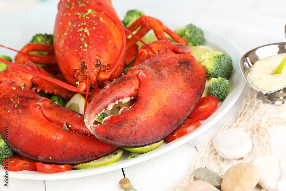 Red lobster on platter on serving table close-up Red lobster on platter on serving table close-up