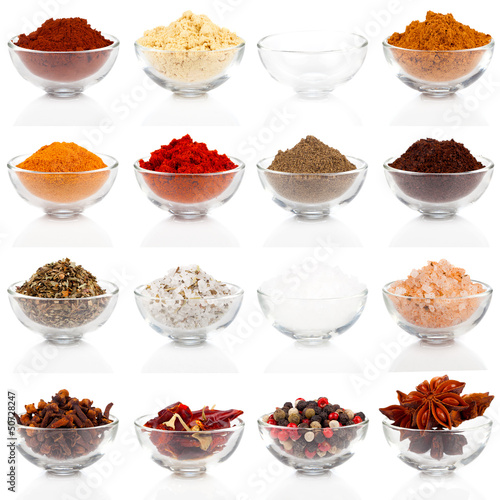Variety of different spices in glass bowls for seasoning, isolat