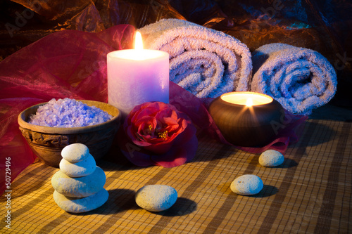 two candles towels camellias stones and salt.jpg
