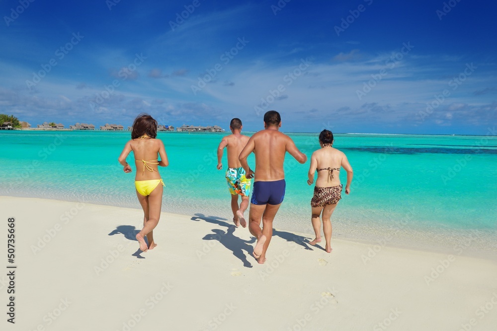 group of happy young people have fun on bach group of happy young people have fun on bach