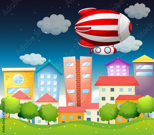 An aircraft above the buildings